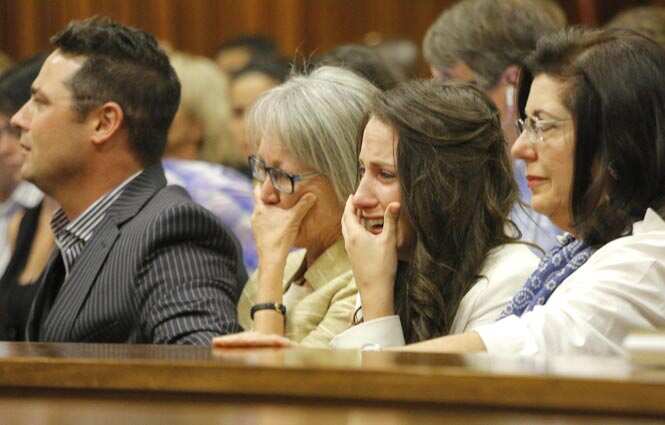 Sister of Oscar Pistorius, Aimee Pistorius, second from right, cries as she listens as her brother testifies in court in Pretoria. (AFP photo) Sister of Oscar Pistorius, Aimee Pistorius, second from right, cries as she listens as her brother testifies in court in Pretoria. (AFP photo)