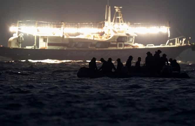 South Korean rescue workers operate at the site where the capsized passenger ship Sewol sank, as fishing boats emit light during the night rescue operation in Jindo. (Reuters)
</div) South Korean rescue workers operate at the site where the capsized passenger ship Sewol sank, as fishing boats emit light during the night rescue operation in Jindo. (Reuters)
</div)