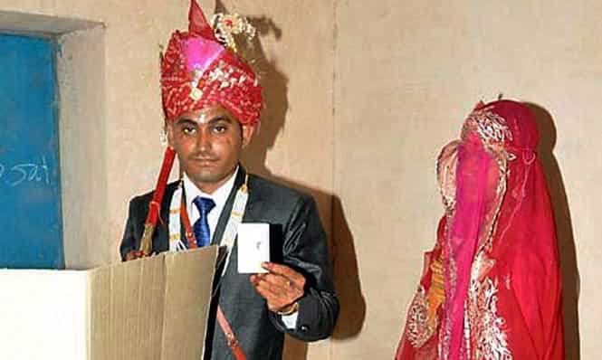 A newly wed couple casting votes at a polling station in Jodhpur. Photo by PTI A newly wed couple casting votes at a polling station in Jodhpur. Photo by PTI