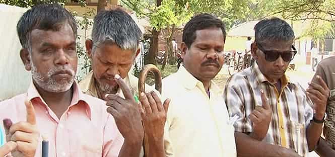 Visually impaired voters showing their ink-marked finger after casting their votes at a polling station in Ranchi. Photo by PTI Visually impaired voters showing their ink-marked finger after casting their votes at a polling station in Ranchi. Photo by PTI