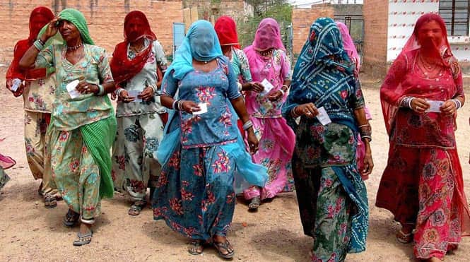 Rural women arrive at a polling station to cast their votes in Jodhpur, Rajasthan. Photo by PTI Rural women arrive at a polling station to cast their votes in Jodhpur, Rajasthan. Photo by PTI