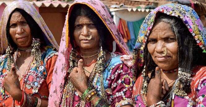 Banjara women show their inked thumbs after casting votes at a polling station in Hubli. Photo by PTI Banjara women show their inked thumbs after casting votes at a polling station in Hubli. Photo by PTI