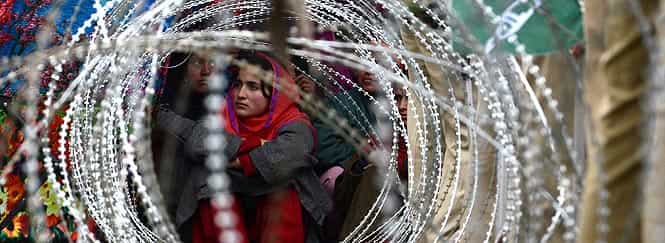 PDP supporters listen at a campaign rally addressed by party patron Mufty Mohammed Syeed (unseen) amid tight security on the outskirts of Srinagar. Photo by AFP
</div) PDP supporters listen at a campaign rally addressed by party patron Mufty Mohammed Syeed (unseen) amid tight security on the outskirts of Srinagar. Photo by AFP
</div)