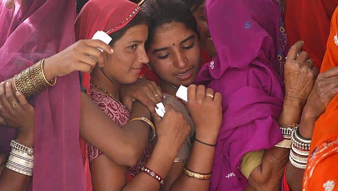 Women wait in a queue to cast their votes at a polling station in Ajmer. Photo by Reuters Women wait in a queue to cast their votes at a polling station in Ajmer. Photo by Reuters