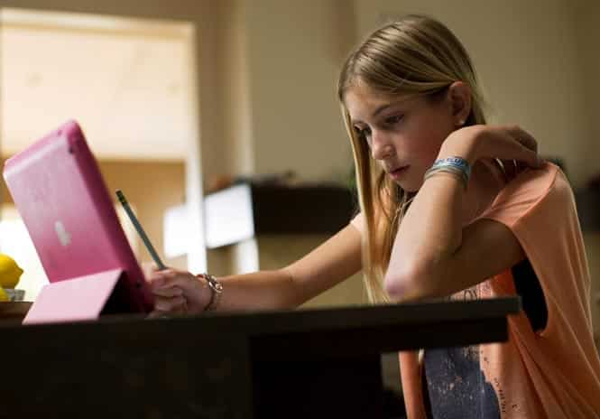 Jaysea DeVoe does schoolwork at her home in Leucadia, California. DeVoe is just 12 years old and recently became a certified yoga instructor after completing 200 hours of teacher training. (Reuters photo)</em) Jaysea DeVoe does schoolwork at her home in Leucadia, California. DeVoe is just 12 years old and recently became a certified yoga instructor after completing 200 hours of teacher training. (Reuters photo)</em)