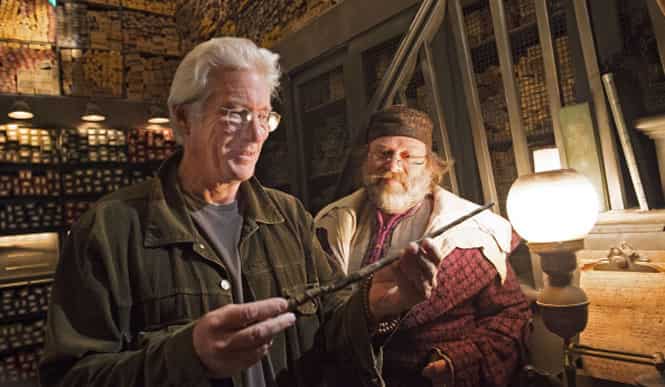 Richard Gere checks out wands at the Ollivanders wand shop at The Wizarding World of Harry Potter - Hogsmeade at Universal Orlando Resort. (Getty Images)