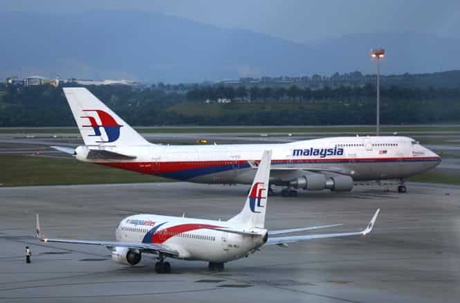 Malaysia Airlines aircrafts taxi on the runway at Kuala Lumpur International Airport in Sepang outside Kuala Lumpur in this May 13, 2014 file photo. (Reuters Photo)</em) Malaysia Airlines aircrafts taxi on the runway at Kuala Lumpur International Airport in Sepang outside Kuala Lumpur in this May 13, 2014 file photo. (Reuters Photo)</em)