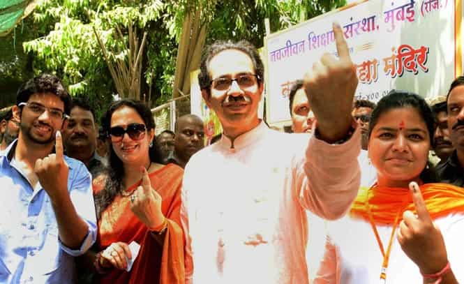 Shiv Sena chief Uddhav Thackeray displays his inked fingers after casting votes for Lok Sabha polls in Mumbai. (PTI photo)
</div) Shiv Sena chief Uddhav Thackeray displays his inked fingers after casting votes for Lok Sabha polls in Mumbai. (PTI photo)
</div)