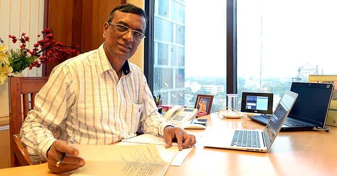 Founder-director of Bandhan Chandra Shekhar Ghosh poses inside his office in Kolkata. Chandra Shekhar Ghosh is a man in a hurry since he beat India's financial titans to win a prized banking licence for his microfinance firm that lends to poor borrowers.(AFP Photo)</em) Founder-director of Bandhan Chandra Shekhar Ghosh poses inside his office in Kolkata. Chandra Shekhar Ghosh is a man in a hurry since he beat India's financial titans to win a prized banking licence for his microfinance firm that lends to poor borrowers.(AFP Photo)</em)