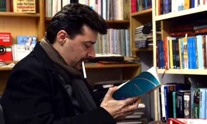 Frenchman and Urdu littérateur Julien Columeau browses the shelves in a book store in Lahore. (AFP Photo)
</div) Frenchman and Urdu littérateur Julien Columeau browses the shelves in a book store in Lahore. (AFP Photo)
</div)