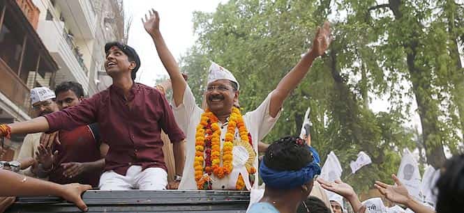 Aam Aadmi Party (AAP) chief Arvind Kejriwal greets supporters during an election campaign rally in Varanasi, in Uttar Pradesh. (AP Photo)</em) Aam Aadmi Party (AAP) chief Arvind Kejriwal greets supporters during an election campaign rally in Varanasi, in Uttar Pradesh. (AP Photo)</em)