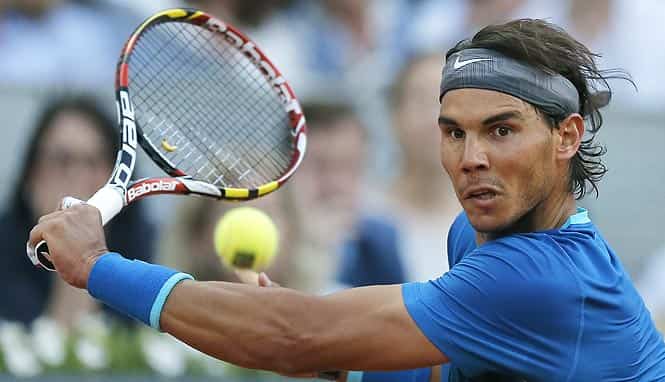 Rafael Nadal from Spain returns the ball during his Madrid Open tennis tournament final match against Kei Nishikori from Japan in Madrid, Spain. (AP Photo)</em) Rafael Nadal from Spain returns the ball during his Madrid Open tennis tournament final match against Kei Nishikori from Japan in Madrid, Spain. (AP Photo)</em)