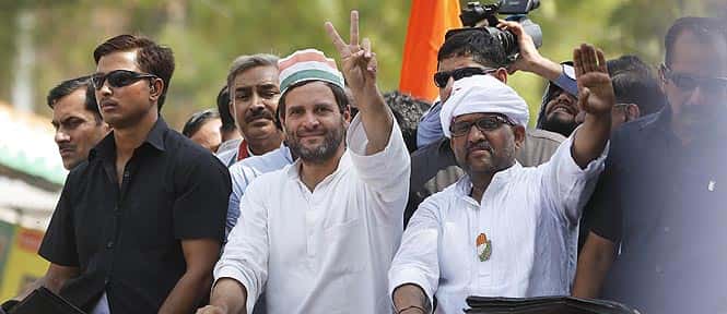 Congress party Vice President Rahul Gandhi displays the victory symbol as the party's candidate Ajay Rai, right, waves to supporters during an election campaign rally in Varanasi. (AP Photo)</em) Congress party Vice President Rahul Gandhi displays the victory symbol as the party's candidate Ajay Rai, right, waves to supporters during an election campaign rally in Varanasi. (AP Photo)</em)