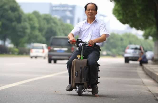 The suitcase-scooter,built by Liangcai over the past 10 years, can travel up to 12.5mph. (AFP Photo)</em>
</div) The suitcase-scooter,built by Liangcai over the past 10 years, can travel up to 12.5mph. (AFP Photo)</em>
</div)