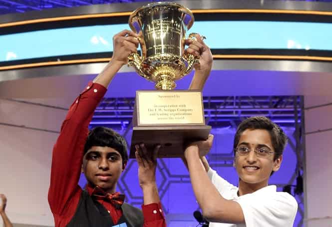 Co-champions of the Scripps National Spelling Bee Ansun Sujoe (L) of Fort Worth, Texas and Sriram Hathwar (R) of Painted Post, New York, hold up their trophy, at National Harbor, Maryland. They are the first co-champions in 52 years. (EPA Photo)</em)