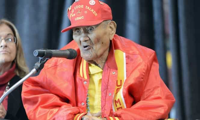 In this photo taken on Nov. 14, 2013, Chester Nez speaks at the Santa Fe Indian School Pueblo Pavilion in Santa Fe, N.M. Nez, the last of the 29 Navajos who developed an unbreakable code that helped win World War II. (AP Photo)</em)