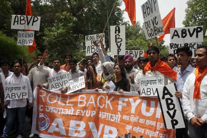 Members of AISA staging a demonstration demanding roll back of FYUP in front of Shastri Bhawan in New Delhi on Monday. (PTI Photo)</em) Members of AISA staging a demonstration demanding roll back of FYUP in front of Shastri Bhawan in New Delhi on Monday. (PTI Photo)</em)