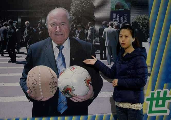 This photo shows FIFA president Sepp Blatter holding a traditional Chinese Cuju ball (L) and a regular football at the Linzi Football Museum in Zibo, Shandong Province. (AFP photo)
</div) This photo shows FIFA president Sepp Blatter holding a traditional Chinese Cuju ball (L) and a regular football at the Linzi Football Museum in Zibo, Shandong Province. (AFP photo)
</div)