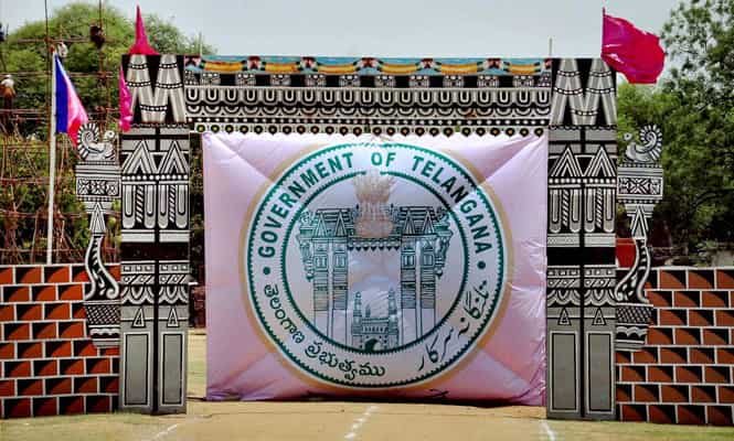 Logo of the newly formed state of Telangana at the parade ground ahead of the celebrations called by TRS, in Secundarabad. (PTI photo)</em>
</div) Logo of the newly formed state of Telangana at the parade ground ahead of the celebrations called by TRS, in Secundarabad. (PTI photo)</em>
</div)