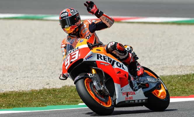 Honda's Spanish rider Marc Marquez waves to supporters at the end of the qualifying session of the motorcycling Italian Grand Prix at the Mugello racetrack. (AFP Photo)</em) Honda's Spanish rider Marc Marquez waves to supporters at the end of the qualifying session of the motorcycling Italian Grand Prix at the Mugello racetrack. (AFP Photo)</em)