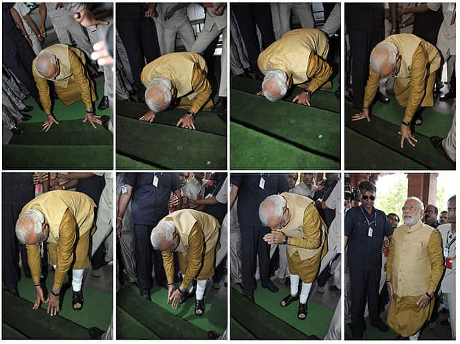 In this combo photo, PM Narendra Modi bows down in respect at the steps of the Parliament house upon his arrival to attend the BJP parliamentary party meeting in New Delhi on May 20. (Sonu Mehta/ HT Photo)</em) In this combo photo, PM Narendra Modi bows down in respect at the steps of the Parliament house upon his arrival to attend the BJP parliamentary party meeting in New Delhi on May 20. (Sonu Mehta/ HT Photo)</em)