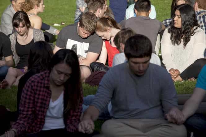 Students pray together after a shooting on campus at Seattle Pacific University in Washington. A man armed with a shotgun opened fire at a small Christian college in Seattle, killing one person and wounding three others before he was subdued by a group of students and arrested, Seattle police and hospital officials said. (Reuters)</em) Students pray together after a shooting on campus at Seattle Pacific University in Washington. A man armed with a shotgun opened fire at a small Christian college in Seattle, killing one person and wounding three others before he was subdued by a group of students and arrested, Seattle police and hospital officials said. (Reuters)</em)