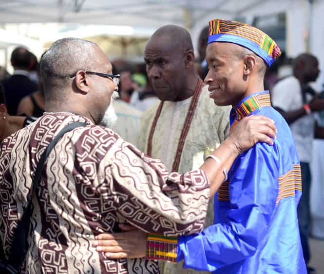 People greet each other during the opening of the Black Cultural Archives in Brixton in south London. (AFP photo)
</div) People greet each other during the opening of the Black Cultural Archives in Brixton in south London. (AFP photo)
</div)