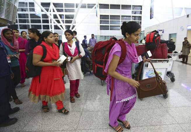 Indian nurses who were set free from Iraq are seen arriving at Kochi airport. (Photo credit: Doordarshan News)</em) Indian nurses who were set free from Iraq are seen arriving at Kochi airport. (Photo credit: Doordarshan News)</em)