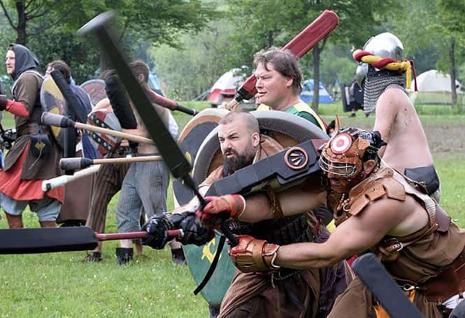 Warriors in full combat gear fight during a battle at the XXIX Dagorhir Ragnarok battle game event at a field near the town of Slippery Rock, Pennsylvania. (AFP photo/Mladen Antonov) 
</div)