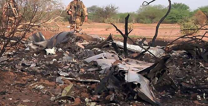 This photo provided by the French army shows soldiers at the site of the plane crash in Mali. French soldiers secured a black box from the Air Algerie wreckage site in a desolate region of restive northern Mali on Friday, the French president said. (AP Photo)</em) This photo provided by the French army shows soldiers at the site of the plane crash in Mali. French soldiers secured a black box from the Air Algerie wreckage site in a desolate region of restive northern Mali on Friday, the French president said. (AP Photo)</em)