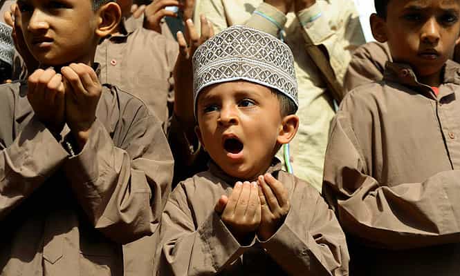 A Muslim boy reacts as he takes part in a special prayer for better rainfall, in Mumbai. (AFP photo)
</div) A Muslim boy reacts as he takes part in a special prayer for better rainfall, in Mumbai. (AFP photo)
</div)