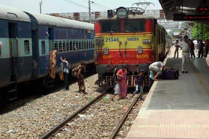 Passengers cross railway tracks in Mirzapur. (PTI Photo)
</div) Passengers cross railway tracks in Mirzapur. (PTI Photo)
</div)