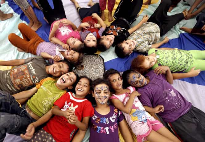 Palestinian children affected by the war attend a group class as part of the United Nations community mental health programmes in the Gaza Strip at a school converted to a refuge in Jabalia, in the north of the Gaza strip. (AFP photo)
</div) Palestinian children affected by the war attend a group class as part of the United Nations community mental health programmes in the Gaza Strip at a school converted to a refuge in Jabalia, in the north of the Gaza strip. (AFP photo)
</div)