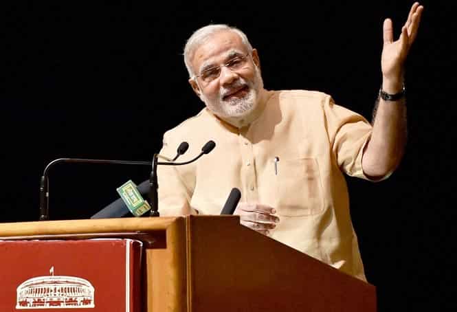 Prime Minister Narendra Modi addresses the audience at a function in the Balyogi auditorium (PLB) in New Delhi. (PTI photo) 
</div)