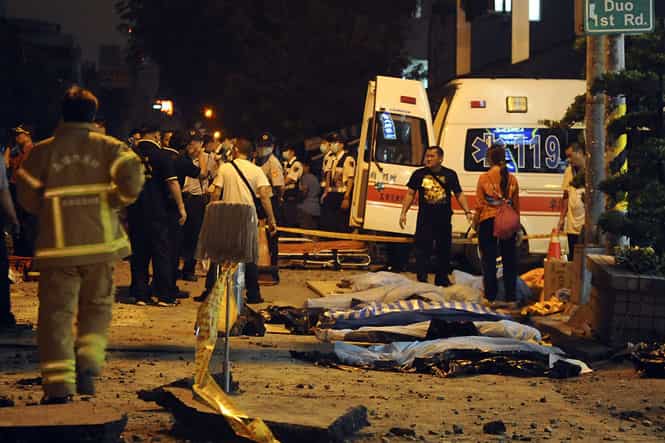 Bodies are seen covered after an explosion in Kaohsiung, southern Taiwan. (Reuters photo)</em>
</div) Bodies are seen covered after an explosion in Kaohsiung, southern Taiwan. (Reuters photo)</em>
</div)