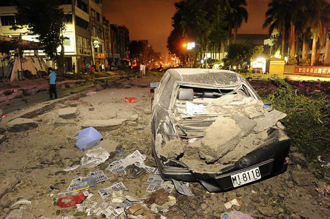 Wreckage of a car is pictured after an explosion in Kaohsiung, southern Taiwan. (Reuters photo)</em>
</div) Wreckage of a car is pictured after an explosion in Kaohsiung, southern Taiwan. (Reuters photo)</em>
</div)