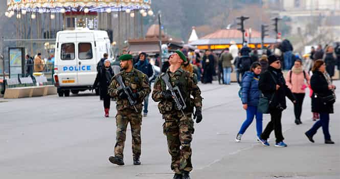 French soldiers patrols at the Eiffel Tower after a shooting at a French satirical newspaper, in Paris, France, on January 7, 2015. AP Photo