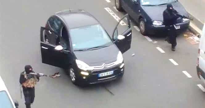 Gunmen flee the offices of French satirical newspaper Charlie Hebdo in Paris, in this still image taken from amateur video shot on January 7, 2015, and obtained by Reuters.