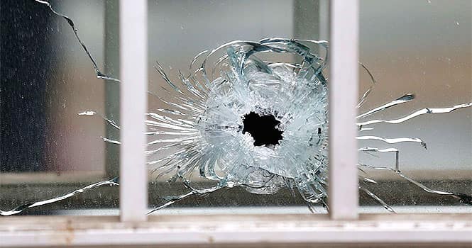 A bullet's impact is seen on a window at the scene after a shooting at the Paris offices of Charlie Hebdo, a satirical newspaper, on January 7, 2015. Reuters Photo