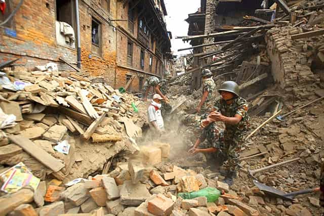 Rescue workers remove debris as they search for victims of earthquake in Bhaktapur near Kathmandu, Nepal on April 26, 2015. AP/PTI Rescue workers remove debris as they search for victims of earthquake in Bhaktapur near Kathmandu, Nepal on April 26, 2015. AP/PTI