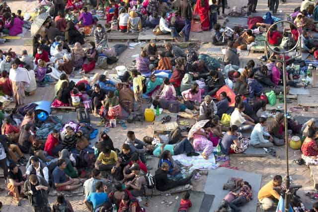 People gather on an open space for security reasons at Basantapur Durbar Square in Kathmandu on April 26, 2015. (AP Photo/Bernat Armangue) People gather on an open space for security reasons at Basantapur Durbar Square in Kathmandu on April 26, 2015. (AP Photo/Bernat Armangue)