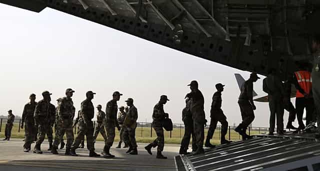 Indian Army personnel prepare relief materials to be airlifted to Nepal to provide assistance to victims at Hindon Air Force Station near New Delhi on April 26, 2015. AFP Photo/Chandan Khanna) Indian Army personnel prepare relief materials to be airlifted to Nepal to provide assistance to victims at Hindon Air Force Station near New Delhi on April 26, 2015. AFP Photo/Chandan Khanna)