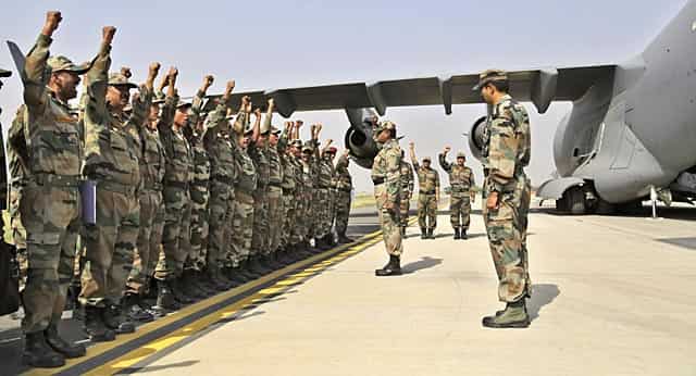 Indian soldiers on rescue mission to Nepal shout patriotic slogans before boarding an Indian Air Force aircraft near New Delhi, India. (AP Photo/Altaf Qadri) Indian soldiers on rescue mission to Nepal shout patriotic slogans before boarding an Indian Air Force aircraft near New Delhi, India. (AP Photo/Altaf Qadri)