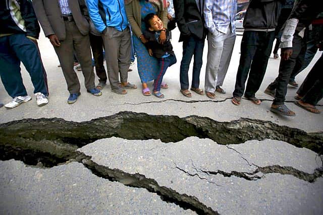 People gather near the cracks on the road caused by an earthquake in Bhaktapur, Nepal. (Reuters Photo/Navesh Chitrakar) People gather near the cracks on the road caused by an earthquake in Bhaktapur, Nepal. (Reuters Photo/Navesh Chitrakar)