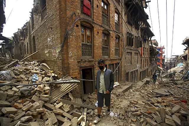 A man walks along damaged houses in Bhaktapur, Nepal. (Reuters Photo/Navesh Chitrakar) A man walks along damaged houses in Bhaktapur, Nepal. (Reuters Photo/Navesh Chitrakar)