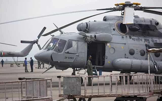 An Indian army helicopter is parked on the tarmac of the Kathmandu international airport on April 26, 2015. (AP Photo/Bernat Armangue) An Indian army helicopter is parked on the tarmac of the Kathmandu international airport on April 26, 2015. (AP Photo/Bernat Armangue)