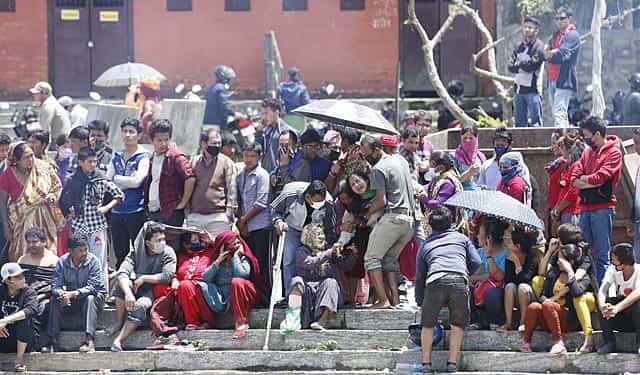 A family Members breakdown during the mass creamtion in Kathmandu, Nepal. (HT Photo/Raj K Raj) A family Members breakdown during the mass creamtion in Kathmandu, Nepal. (HT Photo/Raj K Raj)