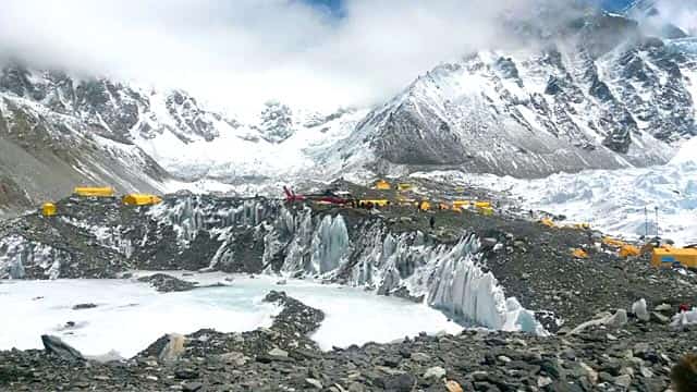 A rescue chopper prepares to land, carrying people from higher camps to Everest Base Camp, Nepal on April 27, 2015. (AP Photo/Nima Namgyal Sherpa) A rescue chopper prepares to land, carrying people from higher camps to Everest Base Camp, Nepal on April 27, 2015. (AP Photo/Nima Namgyal Sherpa)