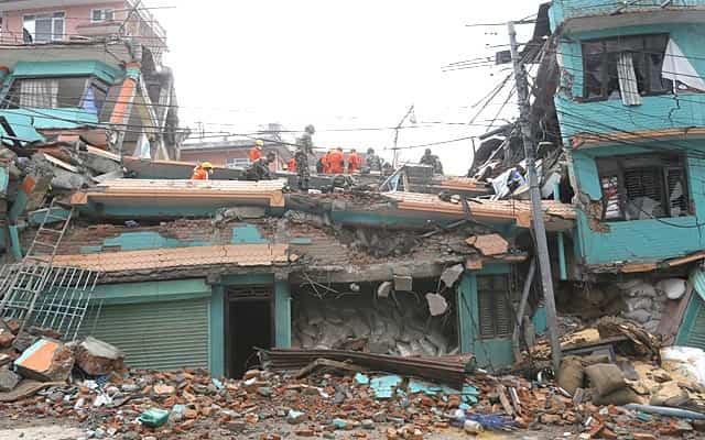 Rescue teams search for bodies in the collapsed Sitapyla church in Kathmandu, Nepal. (AP Photo/Wally Santana) Rescue teams search for bodies in the collapsed Sitapyla church in Kathmandu, Nepal. (AP Photo/Wally Santana)