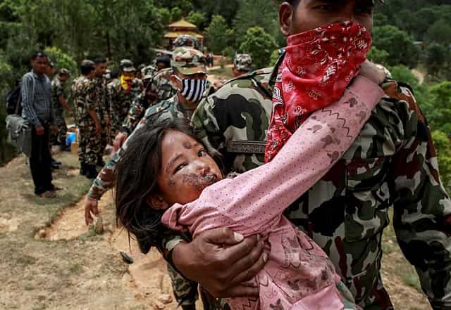 An injured girl is being carried by a Nepal Army personnel to a helicopter in Sindhupalchowk on April 28, 2015. (Reuters Photo/Danish Siddiqui) An injured girl is being carried by a Nepal Army personnel to a helicopter in Sindhupalchowk on April 28, 2015. (Reuters Photo/Danish Siddiqui)